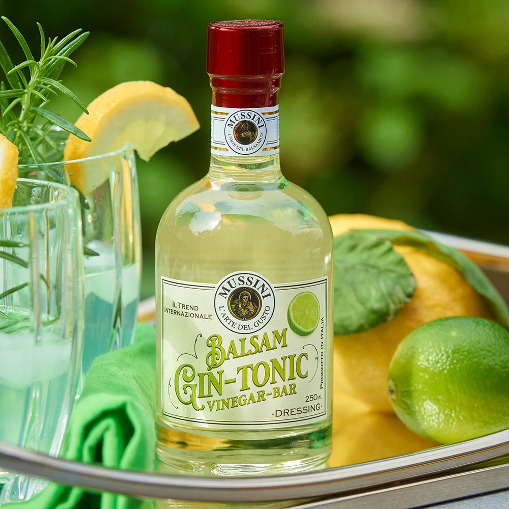 Bottle of Balsam Gin and Tonic Vinegar with decorative background